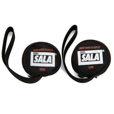 Two flat, round black pouches with straps are shown. Each pouch displays the "DBI SALA" logo and includes instructions to "Unzip Cover to Deploy." One pouch is marked "Hook," and the other is labeled "Loop," serving as crucial safety strap accessories for your harness. These are part of the 3M Fall Protection's DBI-SALA Suspension Trauma Strap 9501403 line.